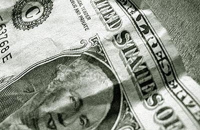 George Washington on a dollar bill, with his tongue out.