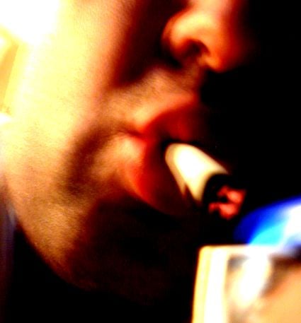 A cigarette is inhaled