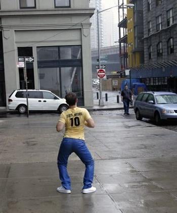 A fellow resembling the author comes upon his friend, as his friend hops up and down like an absolute freak.