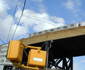 From my window, as it shakes the house, you go by.