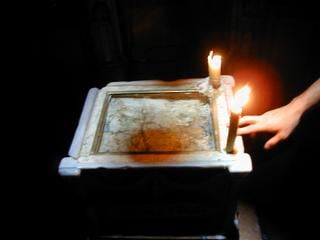 Candles burning above Golgotha.