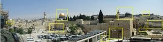Boxes, from the left: a Holocaust memorial, 6 flames placed illegally on a rooftop; the Western wall of the Kotel plaza; the Dome of the Rock; a security checkpoint; the terminal point of Robinson's Arch, which connected to a stairway that led from the main street of Lower Jerusalem; the Al Aqsa mosque; an ancient Arab 'apartment complex' near the Temple, unearthed in an archeological dig; the Seven Arches Hotel (on the summit), where the PLO first met; the Mount of Olives, where the dead will first be resurrected.