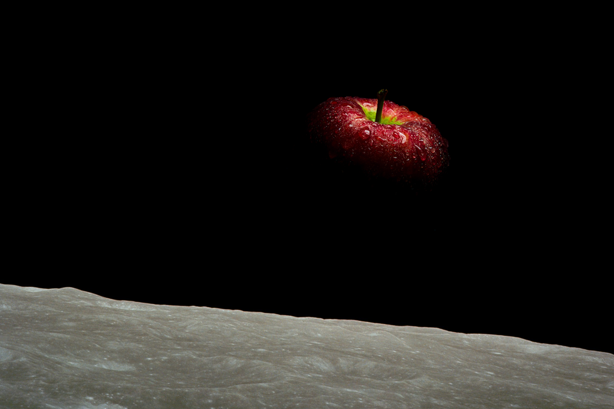 Image of an apple styled as the Death Star, floating in space over a planetary surface.
