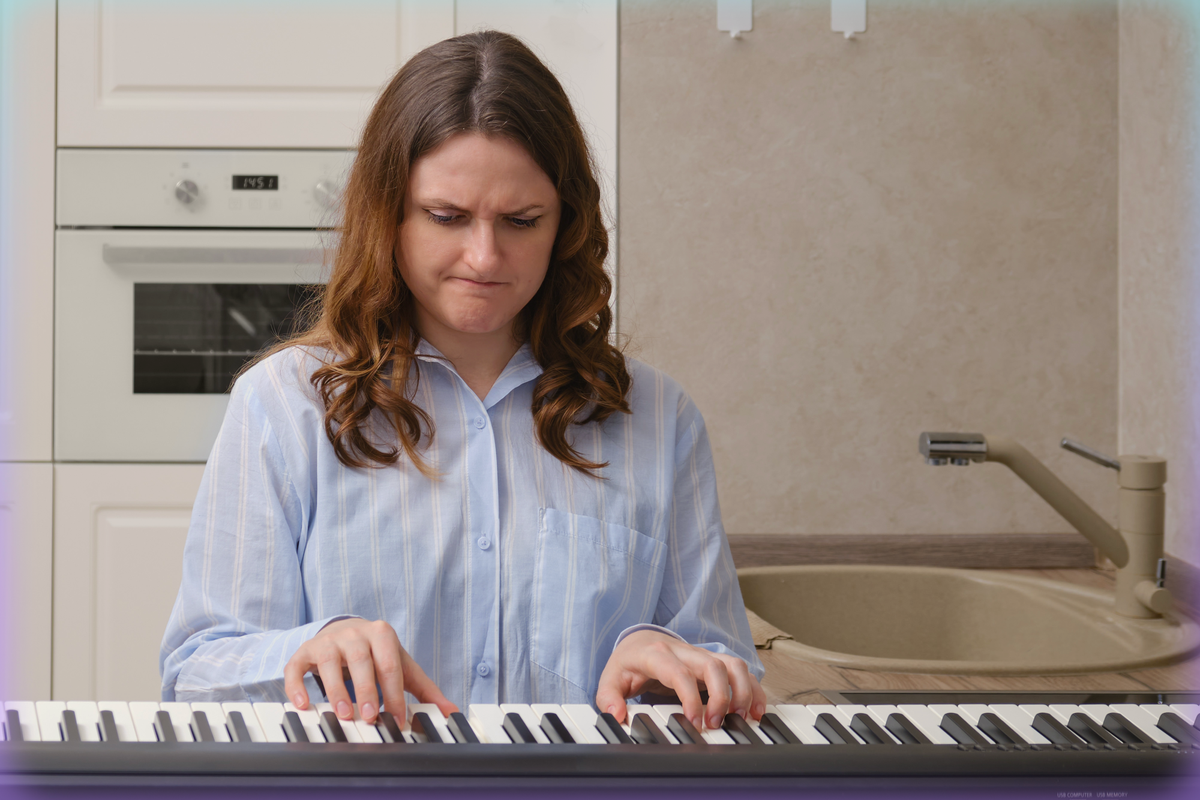 Image of a woman playing the piano and frowning.