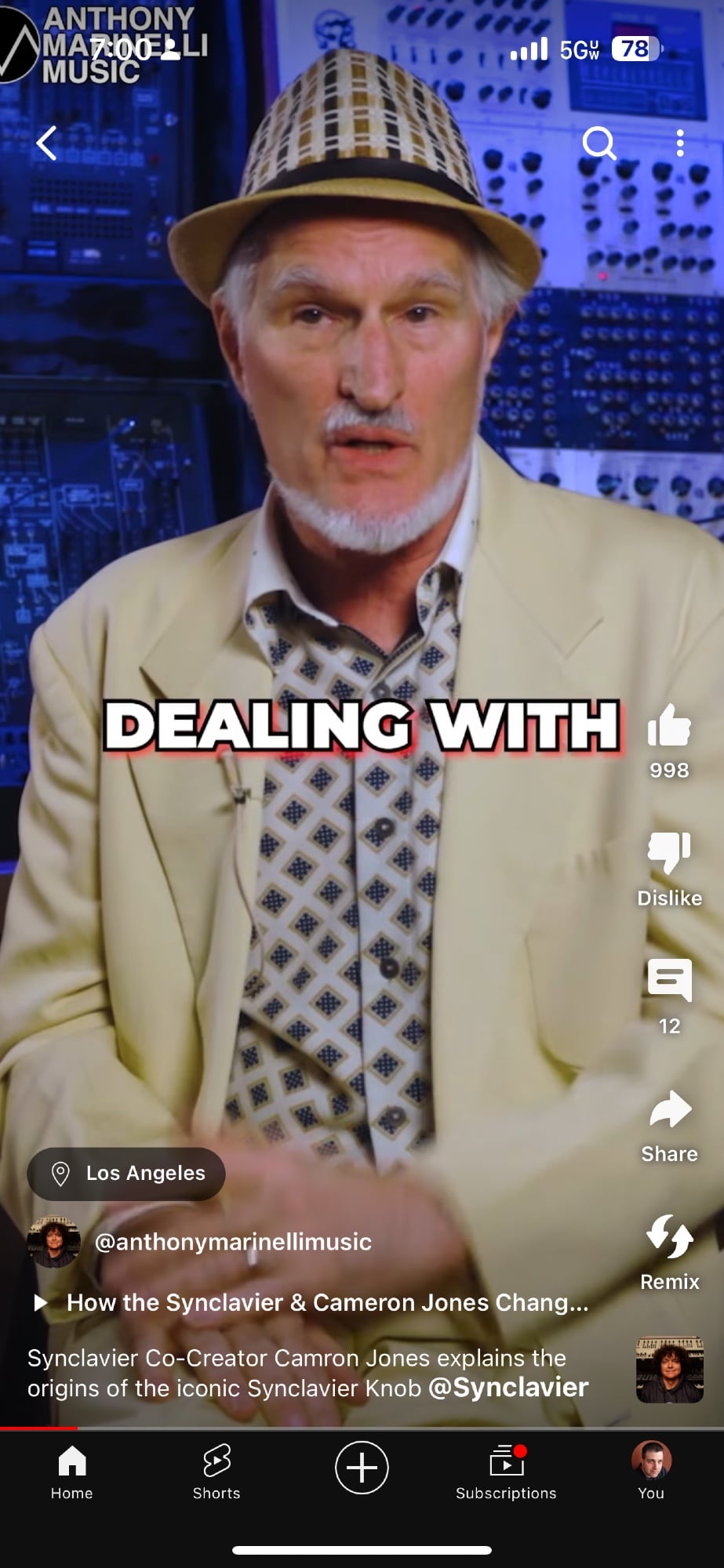 An older guy in a blazer and hat. The subtitles (spread across two images) say: "Dealing with the knob."